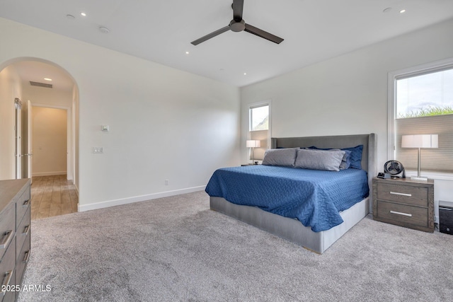 10886 N 137th St, Scottsdale, AZ 85259 - bedroom featuring visible vents, light carpet, recessed lighting, arched walkways, and baseboards