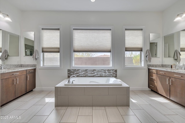 10886 N 137th St, Scottsdale, AZ 85259 - bathroom with two vanities, a bath, a wealth of natural light, and a sink
