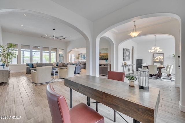 10886 N 137th St, Scottsdale, AZ 85259 - dining area featuring baseboards, light wood-style flooring, recessed lighting, arched walkways, and ceiling fan with notable chandelier