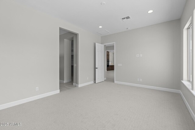 20209 W San Miguel Ave, Litchfield Park, AZ 85340 - empty room with light colored carpet, recessed lighting, and baseboards