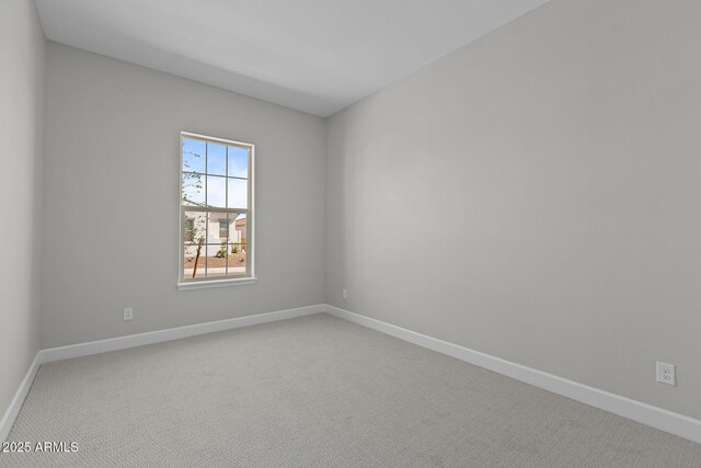 20209 W San Miguel Ave, Litchfield Park, AZ 85340 - carpeted empty room with baseboards