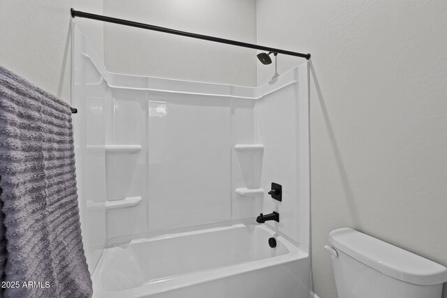 20209 W San Miguel Ave, Litchfield Park, AZ 85340 - full bathroom with a textured wall, toilet, and bathtub / shower combination