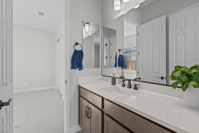 20209 W San Miguel Ave, Litchfield Park, AZ 85340 - bathroom with vanity and baseboards