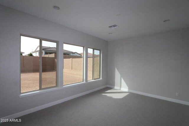 20209 W San Miguel Ave, Litchfield Park, AZ 85340 - carpeted spare room with baseboards