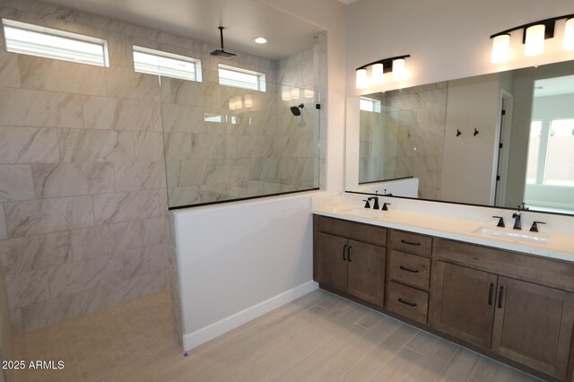 20209 W San Miguel Ave, Litchfield Park, AZ 85340 - full bath with walk in shower, double vanity, baseboards, and wood finished floors