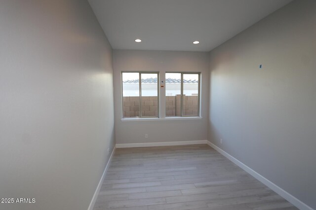20209 W San Miguel Ave, Litchfield Park, AZ 85340 - empty room with light wood finished floors, baseboards, and recessed lighting