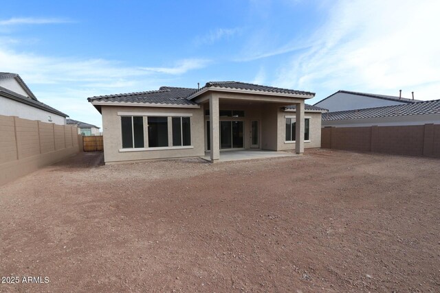 20209 W San Miguel Ave, Litchfield Park, AZ 85340 - rear view of property with a tile roof, stucco siding, a fenced backyard, and a patio