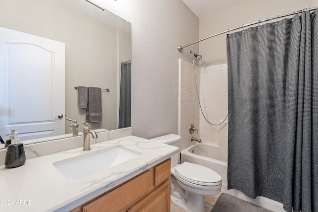 full bathroom with vanity, shower / bath combination with curtain, and toilet