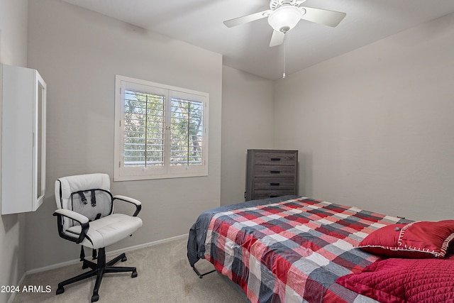 bedroom featuring light carpet and ceiling fan