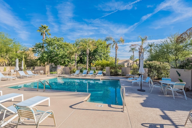 view of swimming pool with a patio