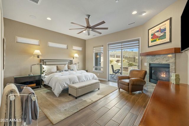 bedroom with ceiling fan and access to exterior