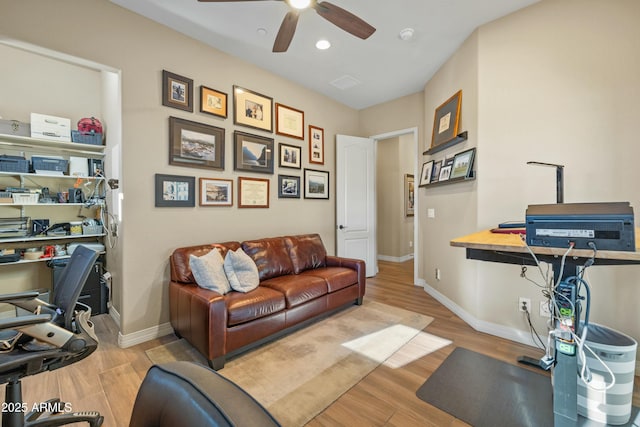 office space with ceiling fan and light hardwood / wood-style flooring