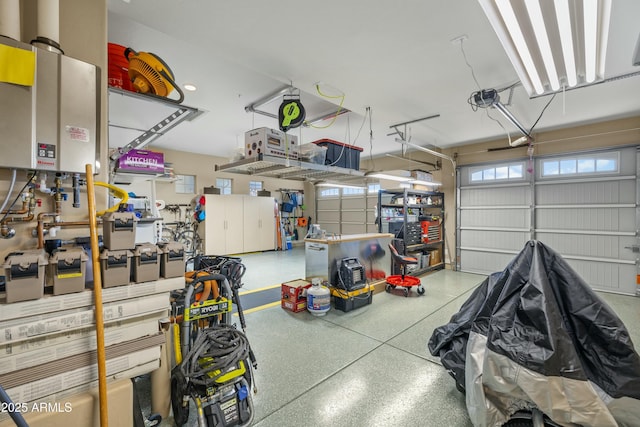 garage with a garage door opener and tankless water heater