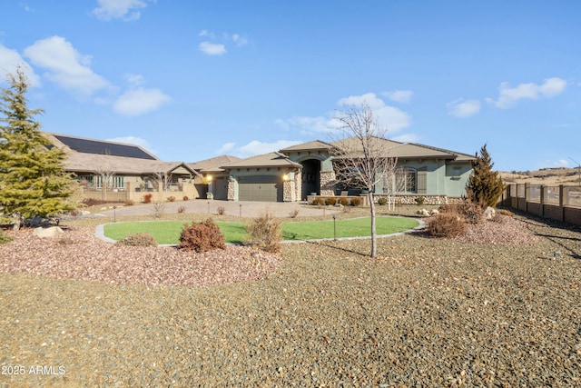 back of property featuring a yard and a garage