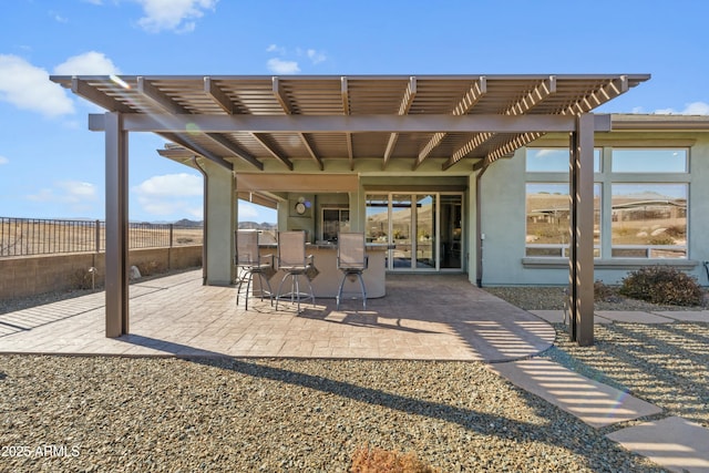 view of patio with a pergola and an outdoor bar
