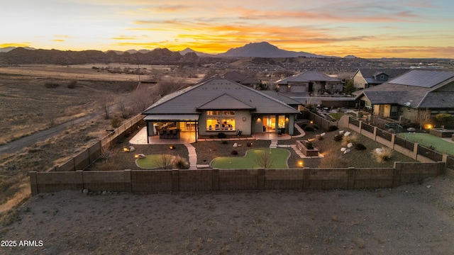 exterior space with a patio area and a mountain view