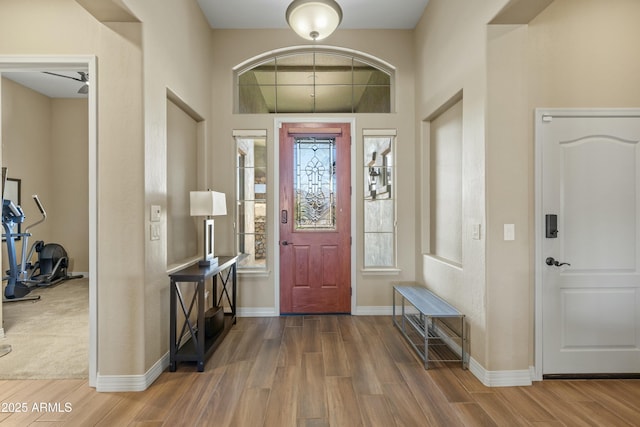 entrance foyer with ceiling fan