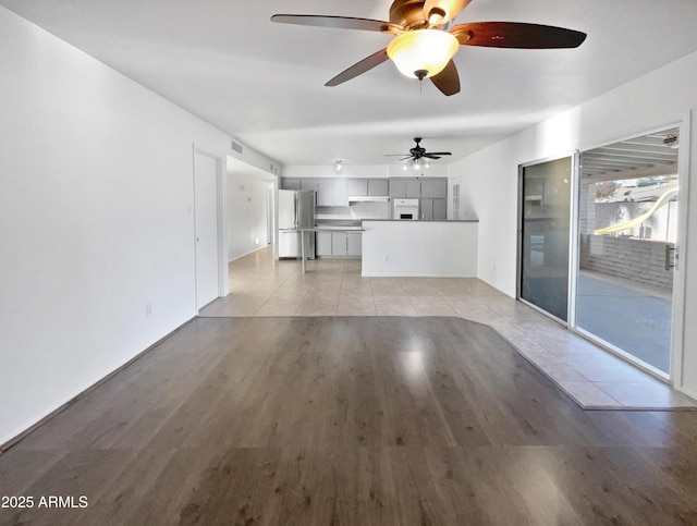 unfurnished living room featuring light wood-style flooring