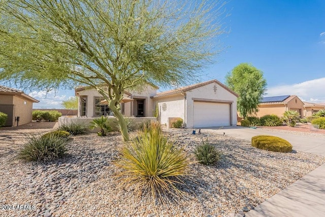 view of front of property with a garage