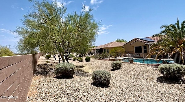 view of yard featuring a fenced in pool