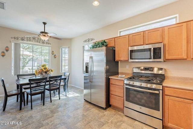 kitchen featuring appliances with stainless steel finishes and ceiling fan