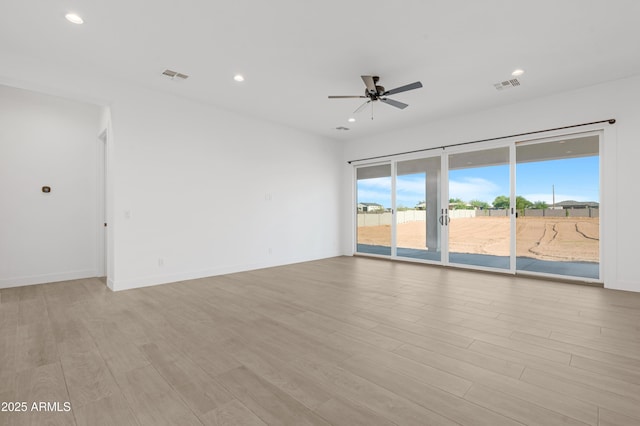 2083 W Lincoln Ct, San Tan Valley, AZ 85144 - spare room featuring a ceiling fan, light wood finished floors, recessed lighting, and baseboards