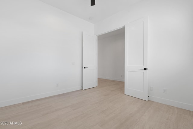 2083 W Lincoln Ct, San Tan Valley, AZ 85144 - spare room featuring ceiling fan, light wood-type flooring, and baseboards