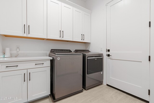 2083 W Lincoln Ct, San Tan Valley, AZ 85144 - laundry room featuring washer and clothes dryer and cabinet space