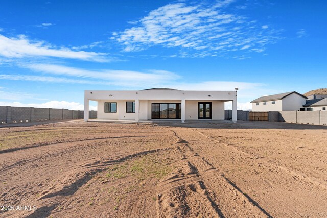 2083 W Lincoln Ct, San Tan Valley, AZ 85144 - back of property featuring stucco siding, french doors, a patio, and a fenced backyard