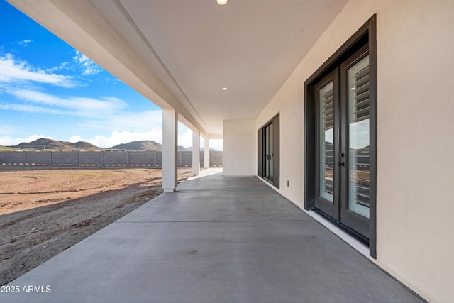 2083 W Lincoln Ct, San Tan Valley, AZ 85144 - view of patio / terrace featuring a mountain view and french doors