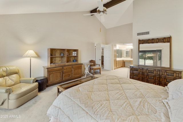 bedroom featuring high vaulted ceiling, connected bathroom, light colored carpet, visible vents, and beam ceiling