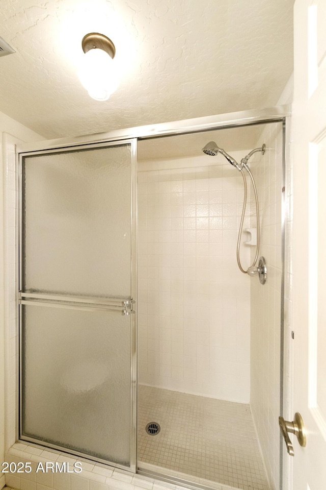 bathroom with a stall shower