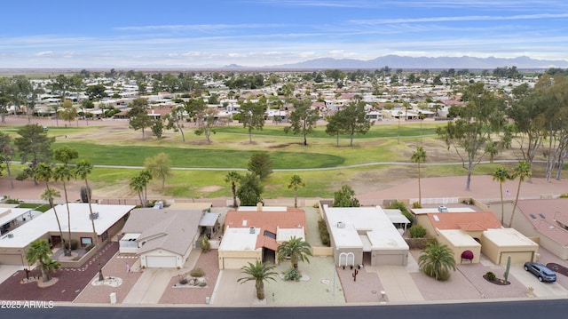 aerial view with a mountain view, golf course view, and a residential view