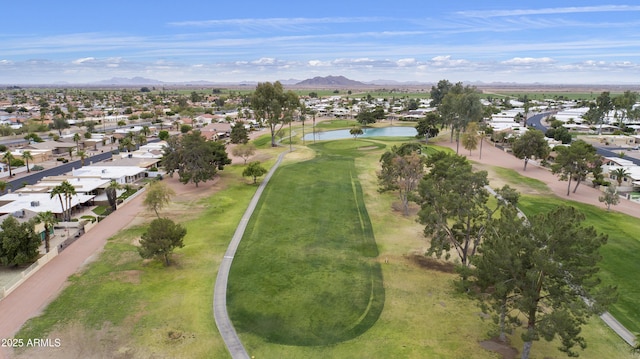 birds eye view of property with golf course view, a residential view, and a water and mountain view