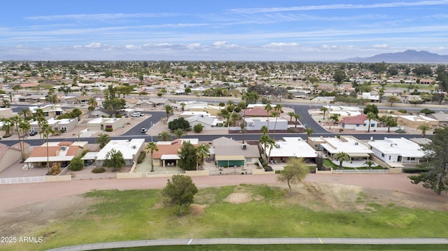 birds eye view of property with a residential view and a mountain view