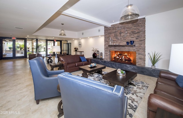 living room featuring a high end fireplace, french doors, and beamed ceiling