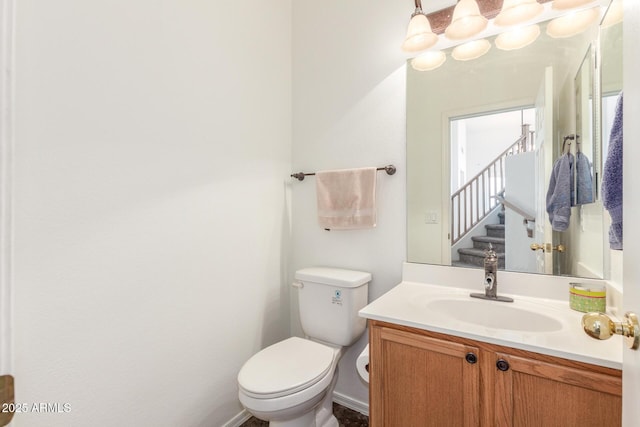 bathroom featuring toilet and vanity