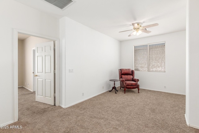 sitting room with carpet floors, baseboards, a ceiling fan, and visible vents