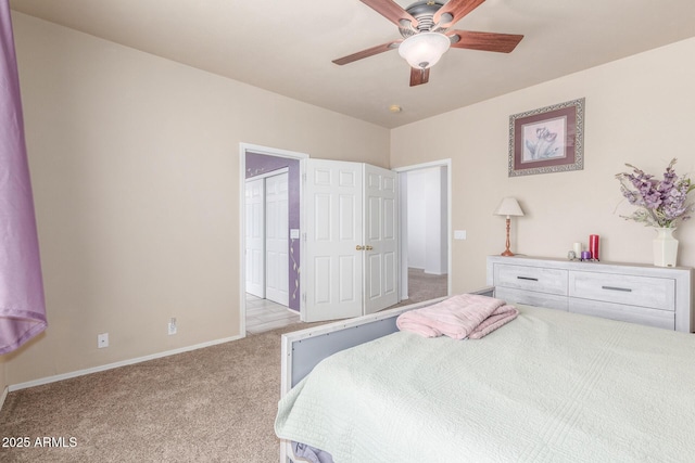 bedroom featuring carpet flooring, baseboards, and a ceiling fan