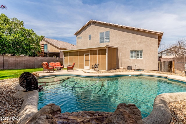 view of pool with a sunroom, a patio, a fenced backyard, and a fenced in pool