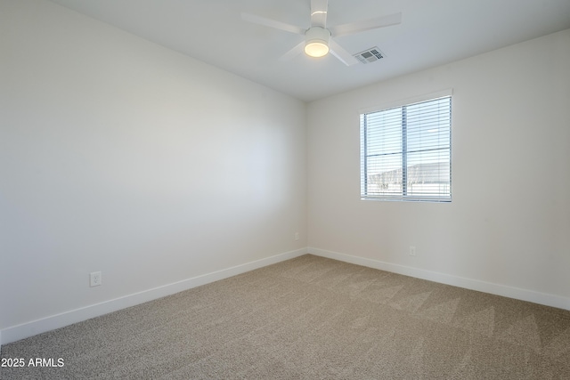 unfurnished room with ceiling fan and carpet floors