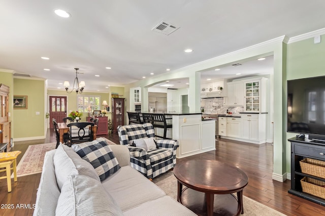 4710 N 33rd Pl, Phoenix, AZ 85018 - living room with a chandelier, ornamental molding, dark wood finished floors, and recessed lighting