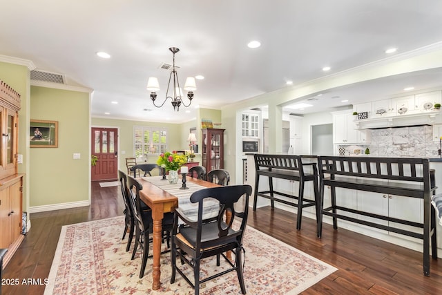 4710 N 33rd Pl, Phoenix, AZ 85018 - dining space with dark wood-style flooring, a chandelier, crown molding, and recessed lighting