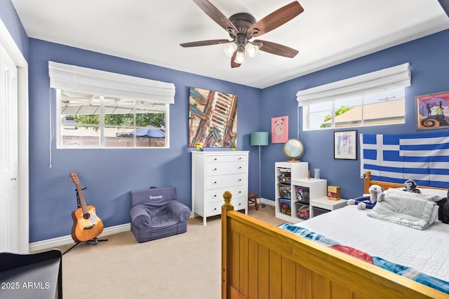 4710 N 33rd Pl, Phoenix, AZ 85018 - carpeted bedroom with baseboards and a ceiling fan
