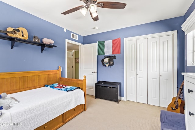 4710 N 33rd Pl, Phoenix, AZ 85018 - bedroom with light colored carpet, a closet, and a ceiling fan
