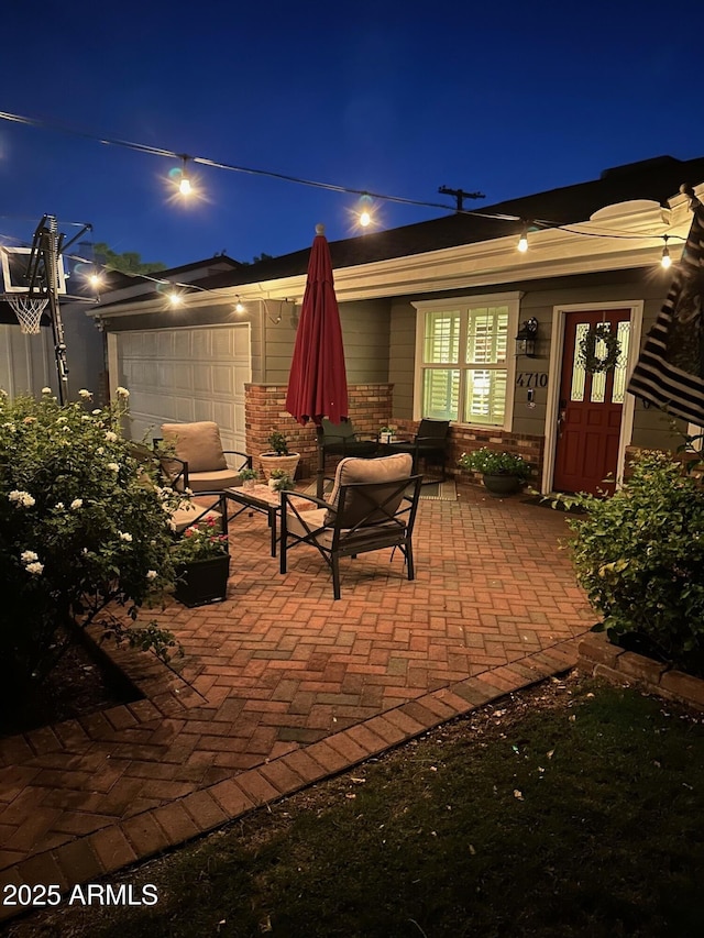 4710 N 33rd Pl, Phoenix, AZ 85018 - patio at night featuring a garage and a patio