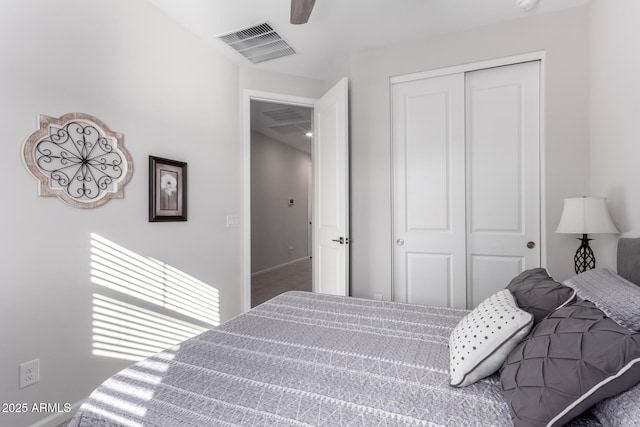 bedroom with ceiling fan and a closet