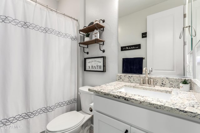 bathroom with toilet and vanity