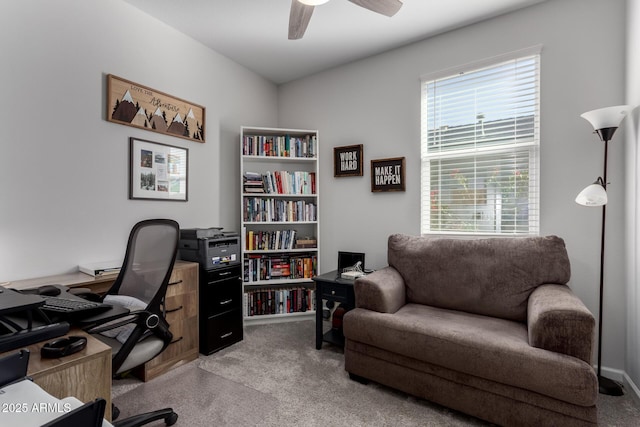 office area with ceiling fan and light colored carpet