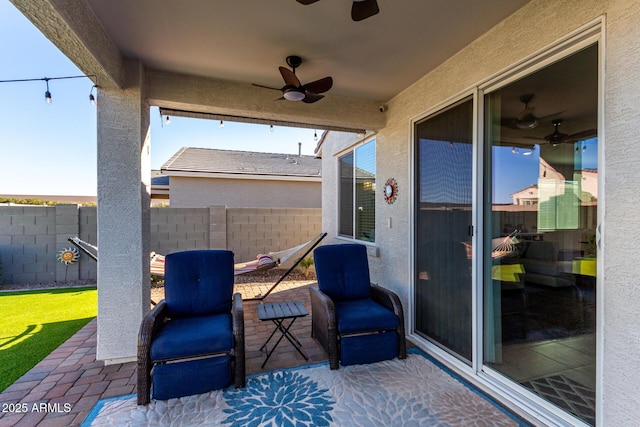 view of patio / terrace featuring ceiling fan